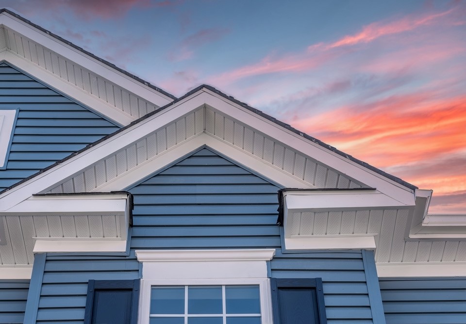 Blue house with white roof siding